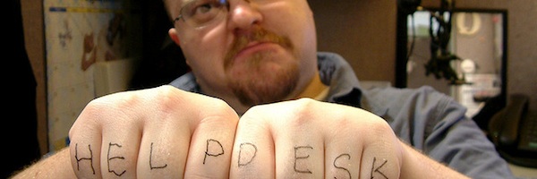 Man with HELP DESK written across his knuckles