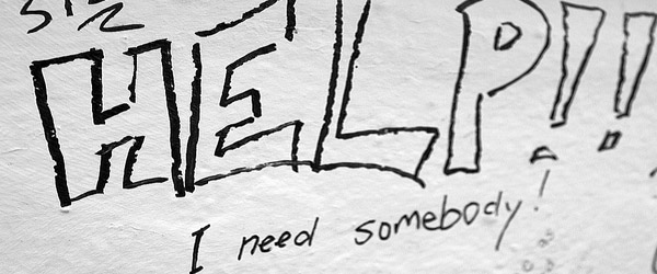 Hand-drawn sign: HELP! I need somebody